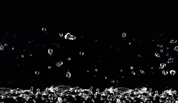 Sponge on the ripple surface. Natural and beautiful air bubbles on the water surface. Many bubbles under water. Natural black background.