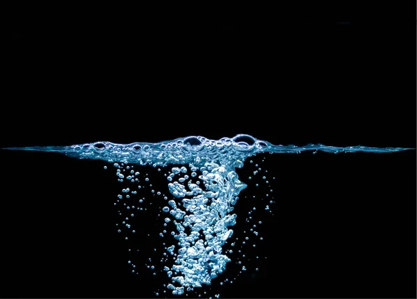 Sponge on the ripple surface. Natural and beautiful air bubbles on the water surface. Many bubbles under water. Natural black background.