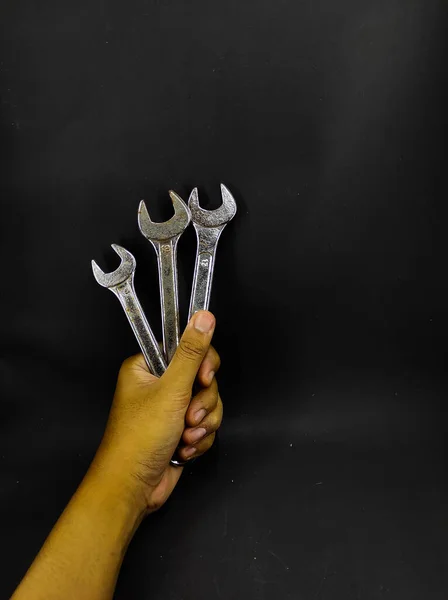 Photo Hand Holding Wrench Isolated Black Background — Stock Photo, Image