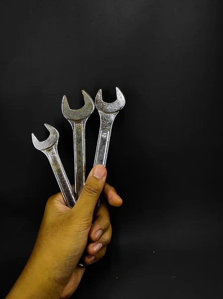 Photo Hand Holding Wrench Isolated Black Background — Stock Photo, Image