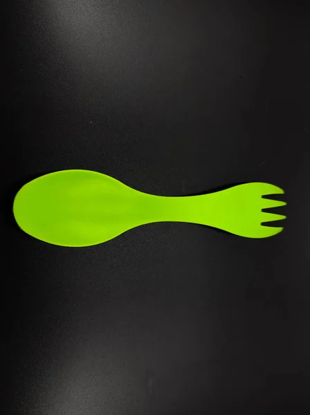 Photo Light Green Fork Spoon One Isolated Black Background Focus — Foto Stock