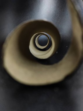 Photo of a white cardboard spiral isolated on a black background, Not Focus