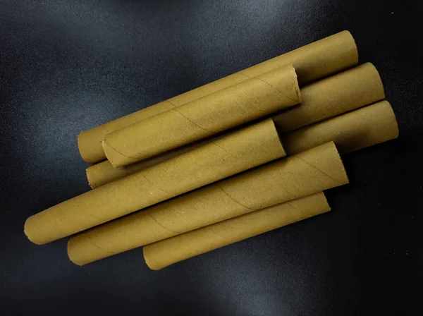 Photo Stack Brown Cardboard Rolls Isolated Black Background Focus — Stockfoto