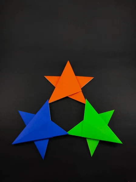 Abstract Defocused Three Colored Star Made Origami Paper Isolated Black — Stock Photo, Image