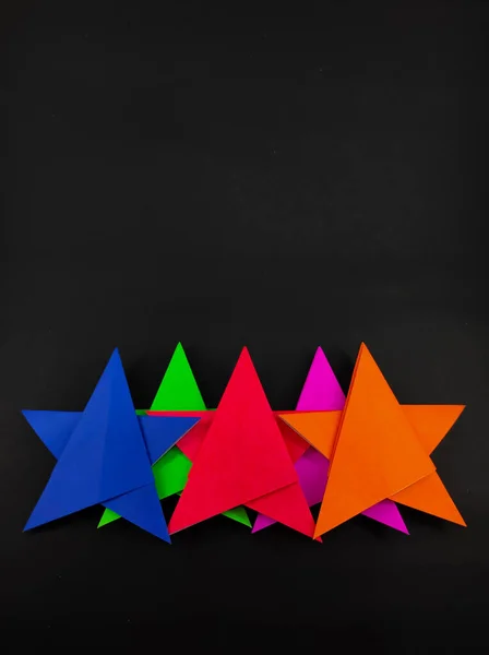 Abstract Defocused Five Colored Star Made Origami Paper Isolated Black — Stock Photo, Image