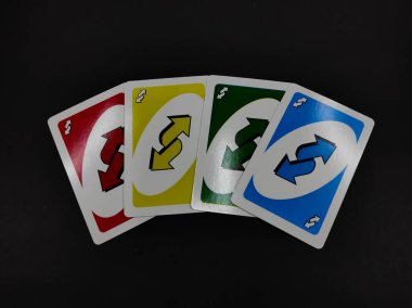 Cikancung, West Java, Indonesia - April 28, 2022 : Abstract Defocused UNO playing card isolated on black background