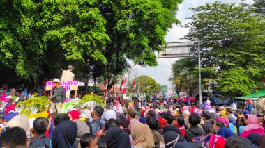 Cicalengka, West Java, Indonesia - 17 August, 2022 : Abstract Defocused Blurred Photo of the festive Indonesian independence celebration parade in the Cicalengka area - Indonesia in the morning. Not Focu