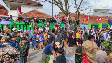 Cicalengka, West Java, Indonesia - 17 August, 2022 : Abstract Defocused Blurred Photo of the festive Indonesian independence celebration parade in the Cicalengka area - Indonesia in the morning. Not Focu