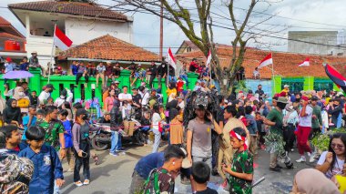 Cicalengka, West Java, Indonesia - 17 August, 2022 : Abstract Defocused Blurred Photo of the festive Indonesian independence celebration parade in the Cicalengka area - Indonesia in the morning. Not Focu