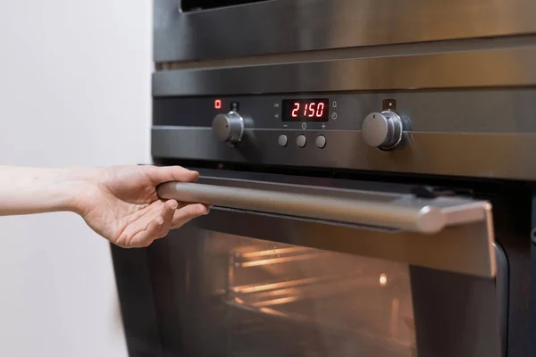 Cropped View Person Hand Opening Black Oven Timer Kitchen Bakery — стоковое фото