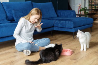 Side view of woman sneezing from wool allergy at home. Person suffering from pet allergy. Bad reactions to cat's fur. Asthma disease problem