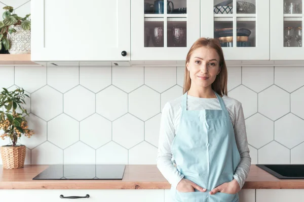 Portrait Smiling Lady Apron Looking Camera Standing Kitchen Contemporary Apartment — стоковое фото