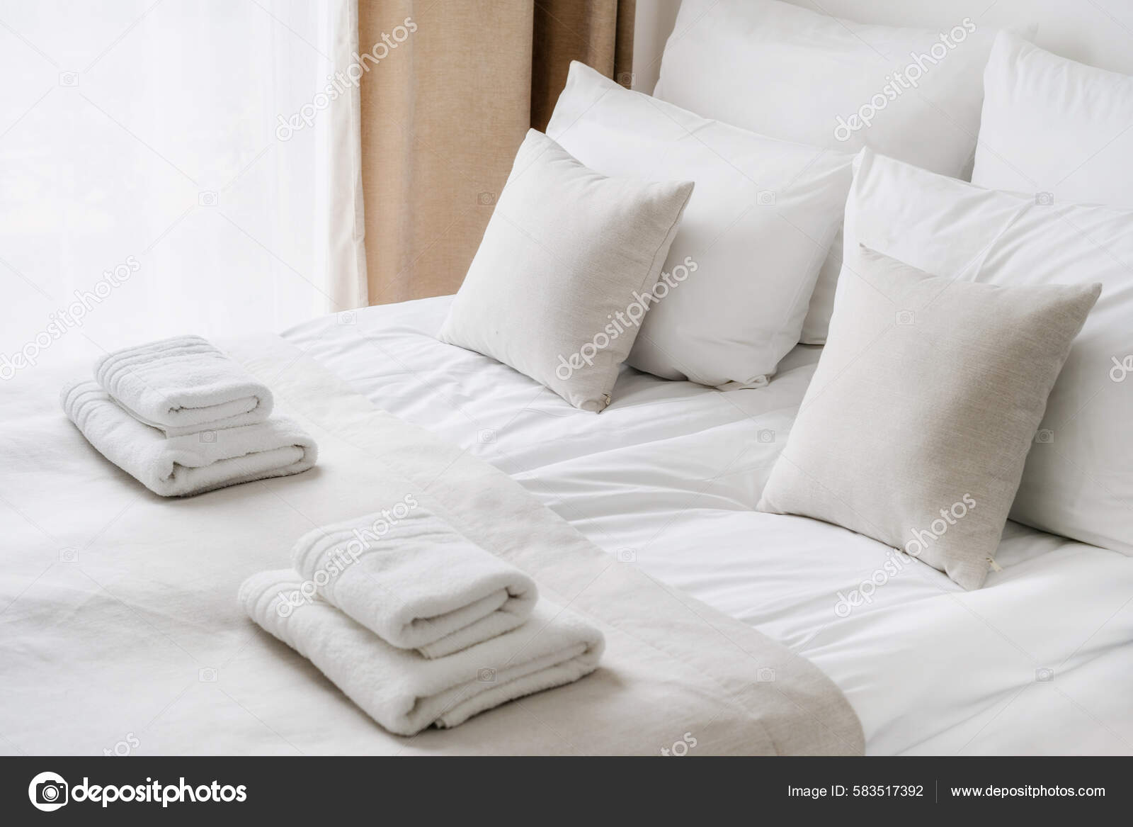 White Fluffy Towels On Bed For Hotel Customer Stock Photo