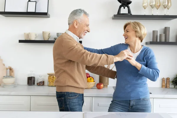 Happy Mature Couple Celebrate Anniversary Marriage Dancing Together Kitchen Senior — ストック写真