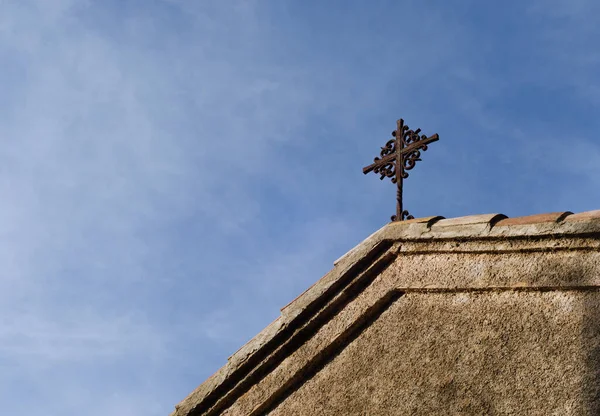 Wooden cross and sky. roof of a small church. a Christian cross. a christian cross in concept of religion and faith