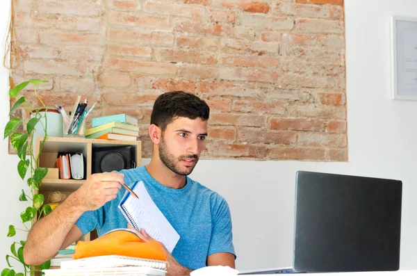 handsome student teaches his homework in a video call. teacher holds a virtual conference with his students to explain his class. businessman presents an idea to his future investors.