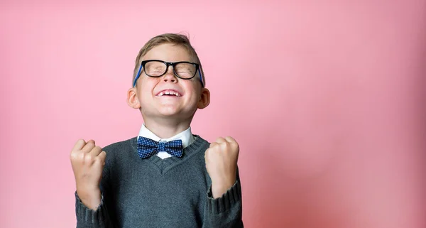 Kid won. Winning success happy boy. School winner. Dynamic image of child with raised hands on pink background. Victory, delight concept. Human facial emotions concept. Trendy colors — Stock Photo, Image