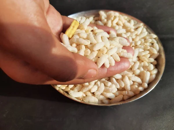 Puffed rice orpopped rice. Its puffed grainmade fromrice. A breakfast cerealsand other snack foods. Traditional methods to puff or pop rice frying inoil, sand and salt. Murmura, roasted grain.