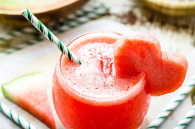 natural watermelon juice decorated with fruit heart, red fruit cocktail served chilled, summer drink
