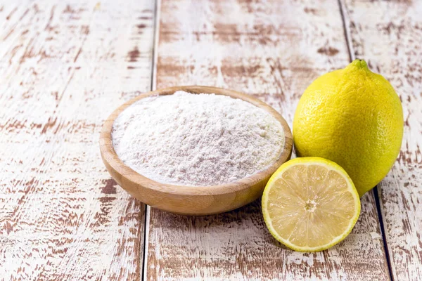 lemon bicarbonate of soda on white wooden background