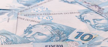 Brezilya 'dan gelen çeşitli 100 reais banknotları, geçmiş, doku, büyük ödül veya piyango konsepti üzerine Brezilya parası