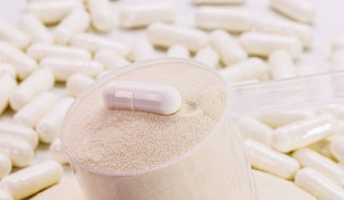 creatine capsule, sports supplement, creatine, hmb, bcaa, amino acid or vitamin powder. Sports nutrition concept, l-carnitine