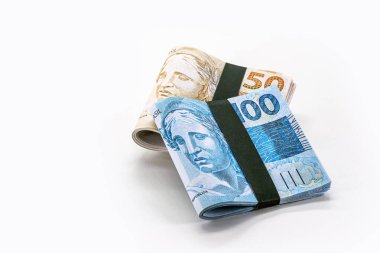 wad of money from brazil, thousand reais in wad of money, 100 reais banknote, grand prize, copyspace, white background