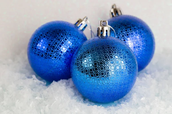 Blue christmas balls on the snow — Stock Photo, Image