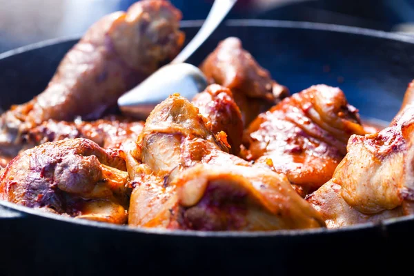 Cooked pork knuckles in a frying pan — Stock Photo, Image