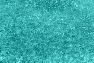 Rain splashing on water. Rainy background for the design. Blue, turquoise. Selective focus, defocus