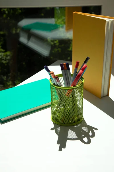 Green Glass Colorful Pencils Scissors Two Notebooks Green Yellow White — Fotografia de Stock