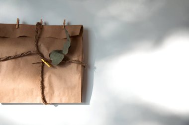 Gift package with dry lavender flowers on a white background. Top view