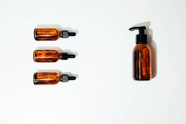 Group Clear Amber Bottles Natural Cosmetics White Background Flat Lay — Stock Photo, Image