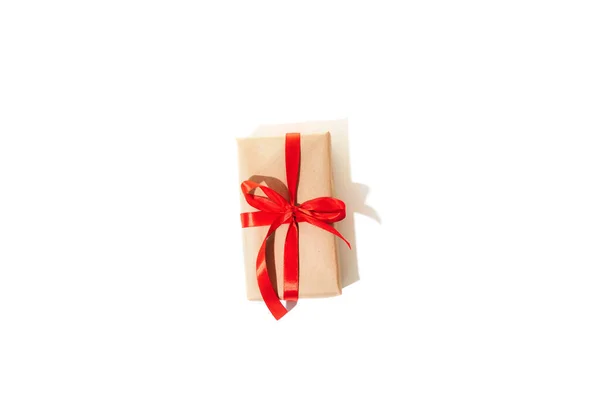 Gift Wrapped Brown Paper Tied Red Ribbon Isolated White Background — Stock Photo, Image