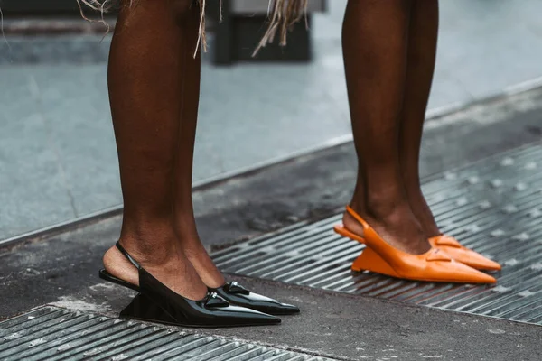 MILAN, ITALY - FEBRUARY 24: Street style outfit - detail of Prada shoes.