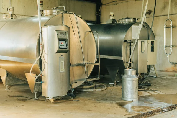 couple of milk containers storing milk milked from cows