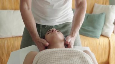 woman receiving osteopathic treatment. High quality 4k footage