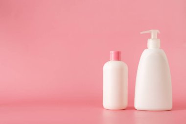Cosmetics, Moisturizer, Bottle. Different cosmetic bottles. set of cosmetic products on pink background. Cosmetic package collection for cream, soups, foams, shampoo.