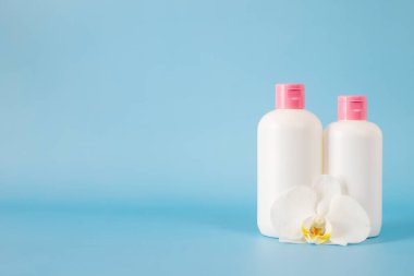 Cosmetics, Moisturizer, Bottle. Different cosmetic bottles. set of cosmetic products on blu background. Cosmetic package collection for cream, soups, foams, shampoo.