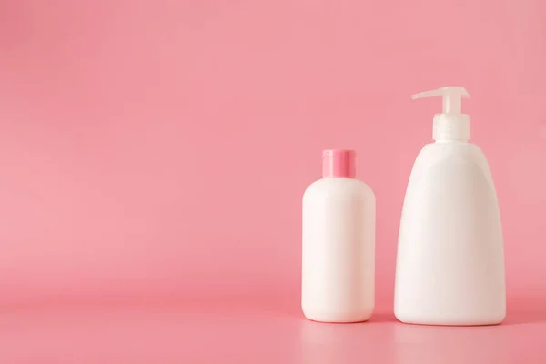 Cosmetics, Moisturizer, Bottle. Different cosmetic bottles. set of cosmetic products on pink background. Cosmetic package collection for cream, soups, foams, shampoo.