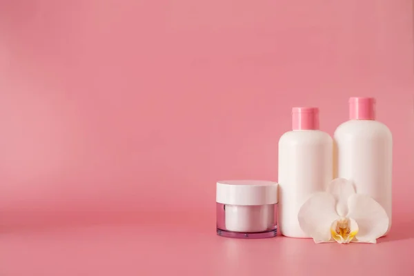 Cosmetics, Moisturizer, Bottle. Different cosmetic bottles. set of cosmetic products on pink background. Cosmetic package collection for cream, soups, foams, shampoo.