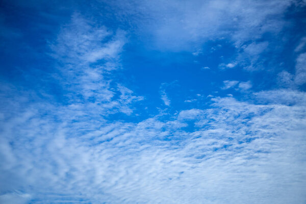 Blue sky background and white clouds soft focus.