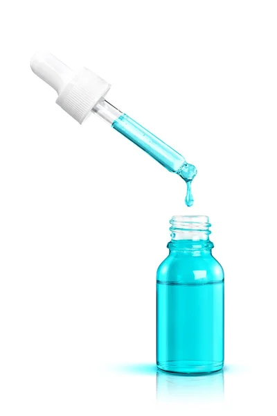 Cosmetische Serum Druppel Valt Uit Een Pipet Een Blauwe Fles — Stockfoto