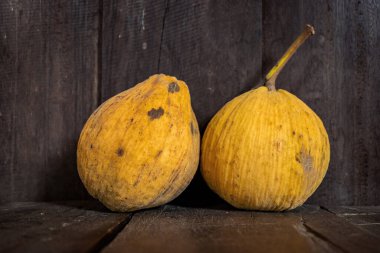 Santol or wild mangosteen the tropical Thai fruit on vintage wooden plank background