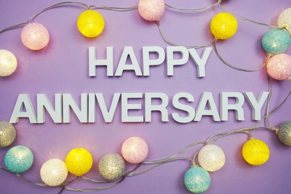 Happy Anniversary Alphabet Letters Led Cotton Ball Decoration Purple Background — Stock Photo, Image