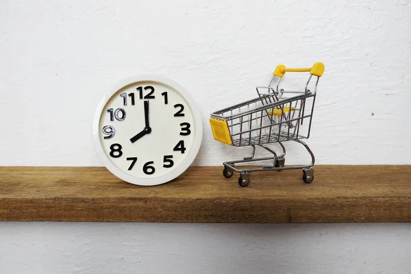 White Alarm Clock Yellow Mini Shopping Trolley Cart Wooden Shelves — Fotografia de Stock