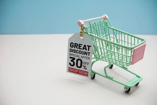 Great Discount 30% offCyber Monday Sale 50%  text message on price tax with shoppint trolley cart on blue andp pink background