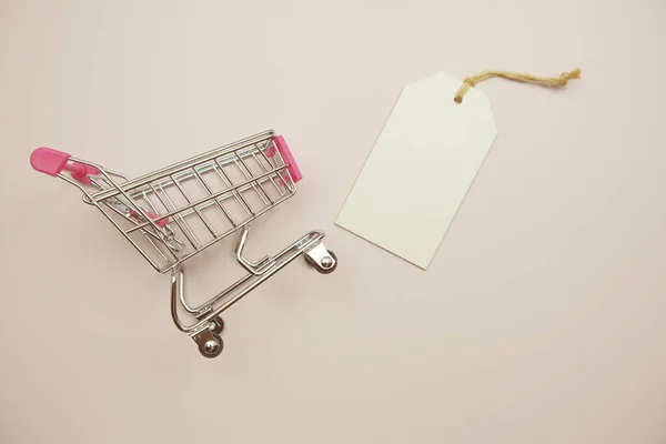 Price Tag Shopping Trolley Cart Pink Background — Fotografia de Stock