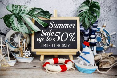 Summer sale text message decoration with nautical marine on wooden background