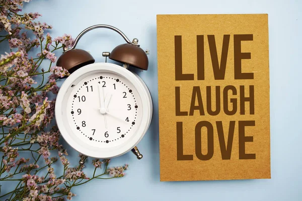 Live Laugh Love Written Paper Card Flower Alarm Clock Blue —  Fotos de Stock